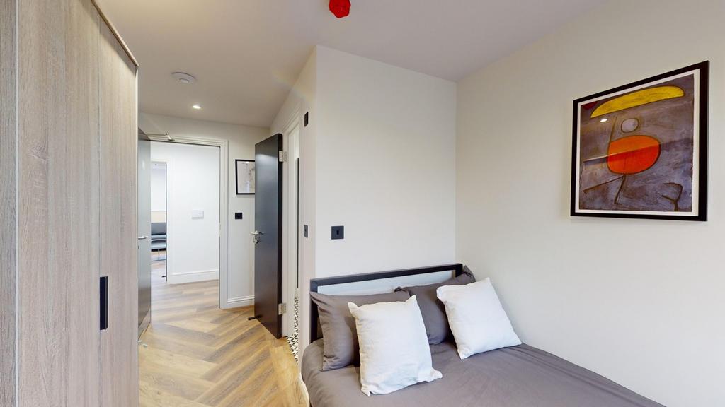 A stylish and inviting double bedroom with mode...