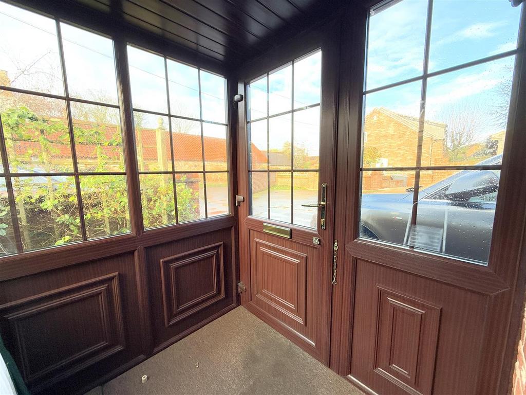 Initial enclosed storm porch