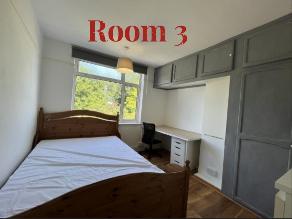 A bright and spacious double bedroom with ample...