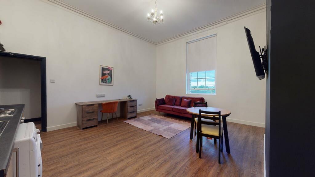 A spacious and modern living room with ample na...