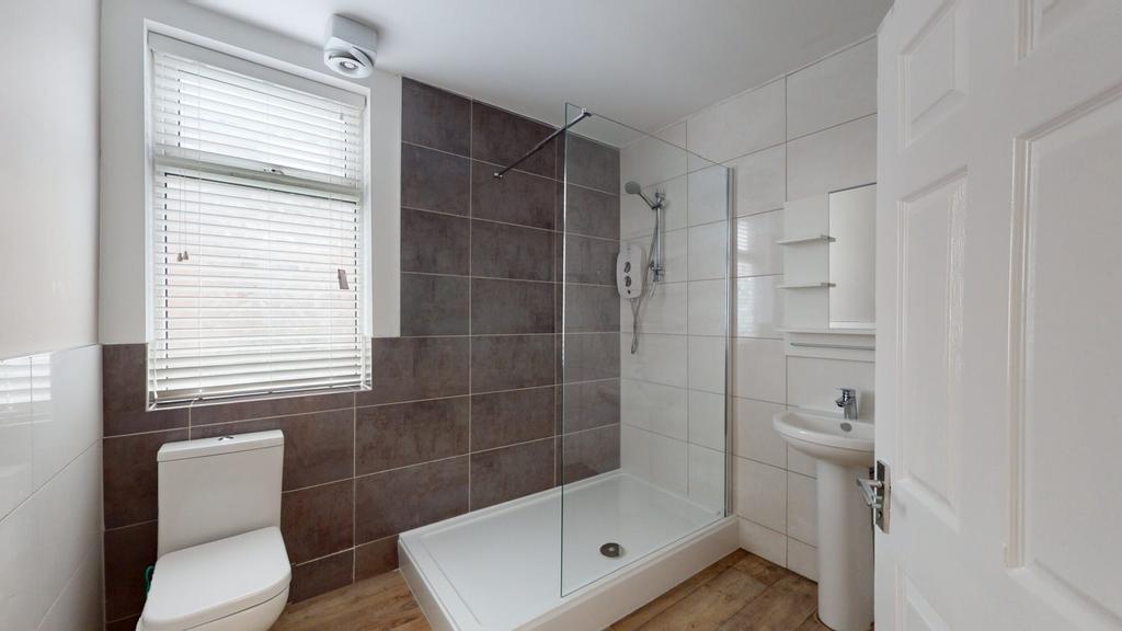 A modern and well maintained bathroom featuring...