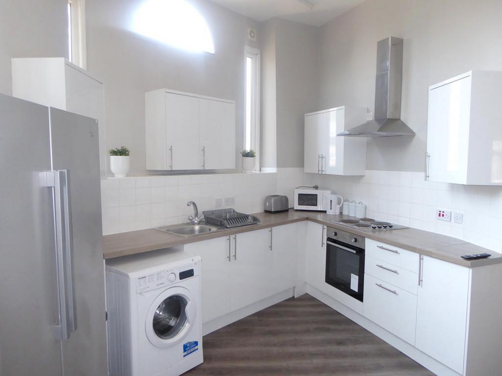 A bright and modern kitchenette featuring sleek...