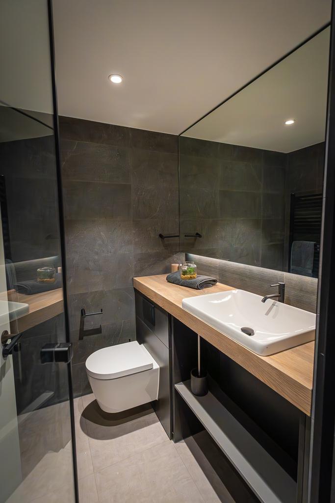 A modern and stylish bathroom featuring sleek f...