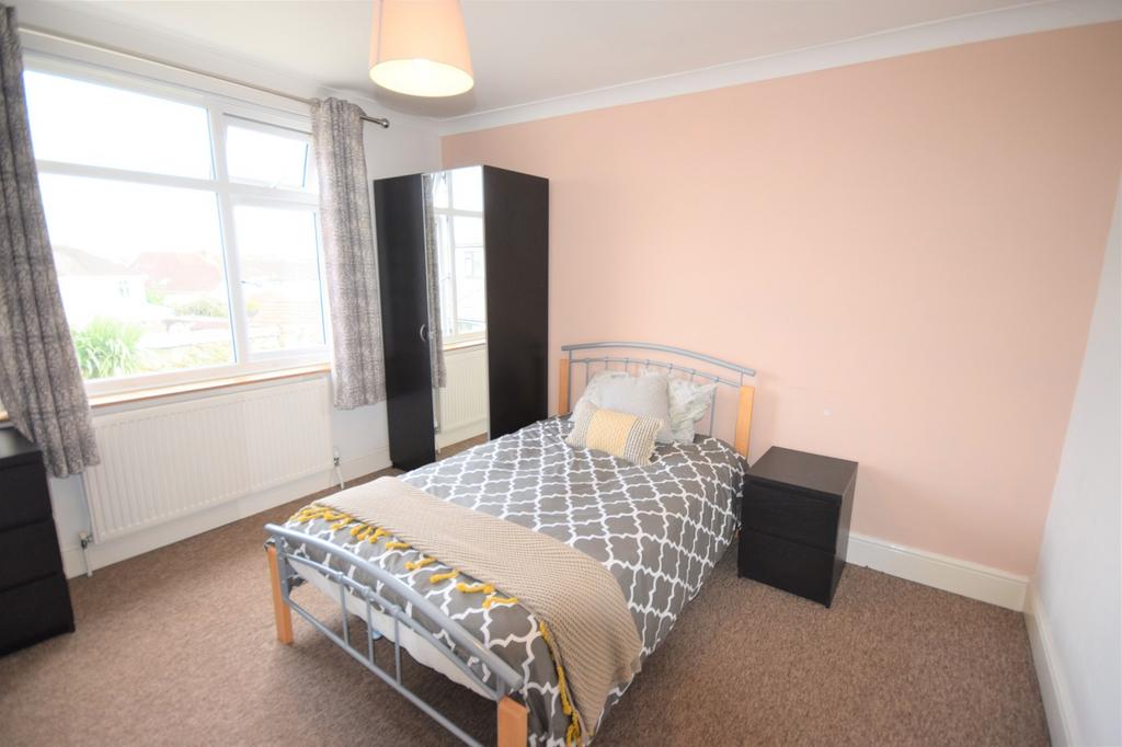 A bright and inviting double bedroom with ample...