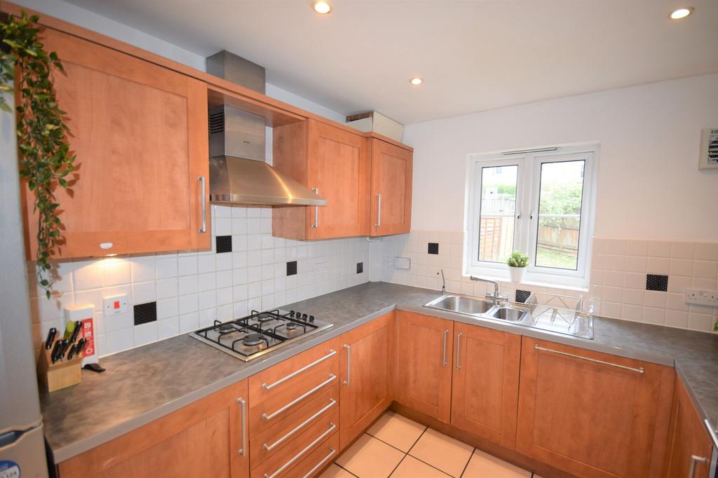 A clean and bright kitchenette featuring modern...