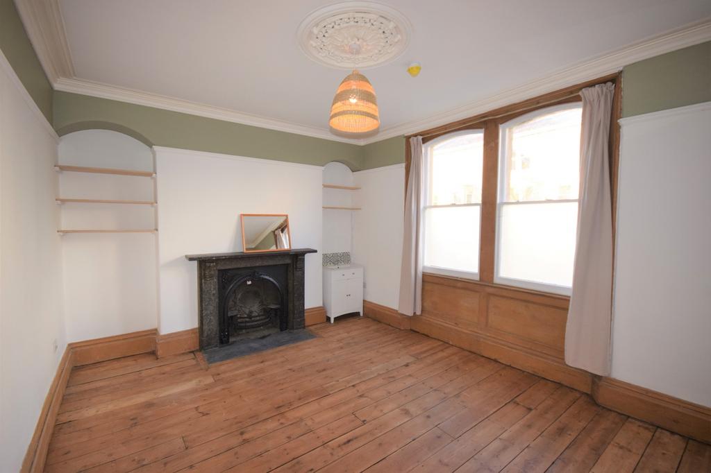 A spacious and inviting double bedroom featurin...