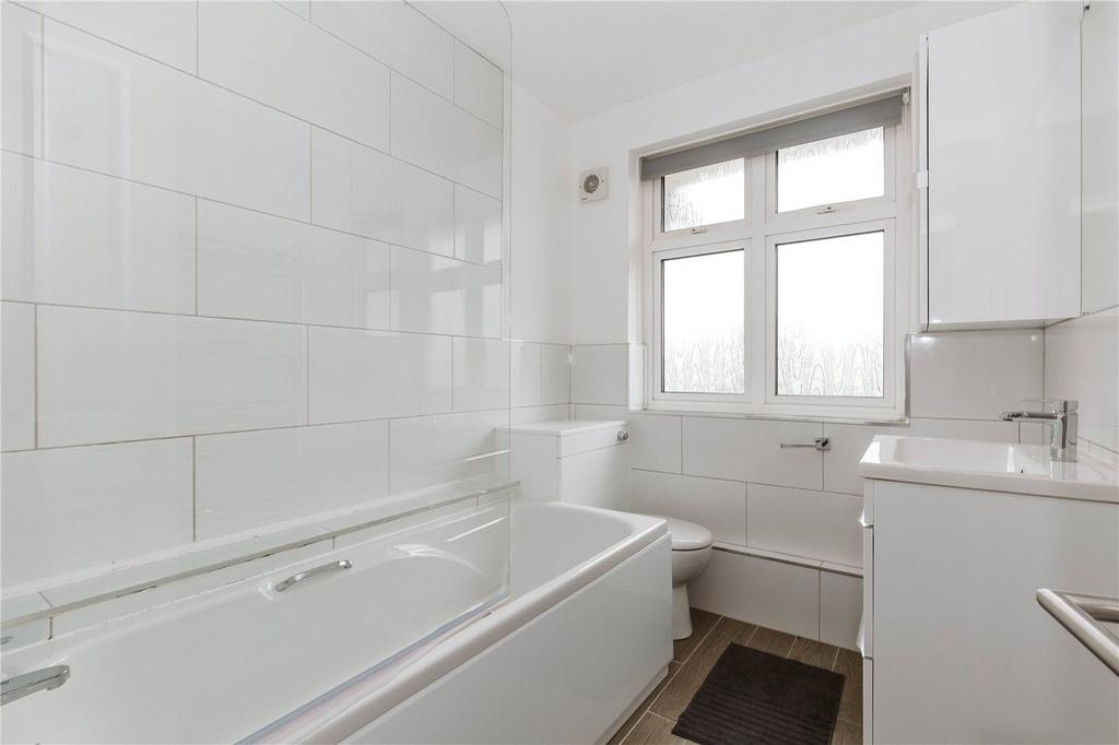 A bright and spacious large bathroom featuring ...