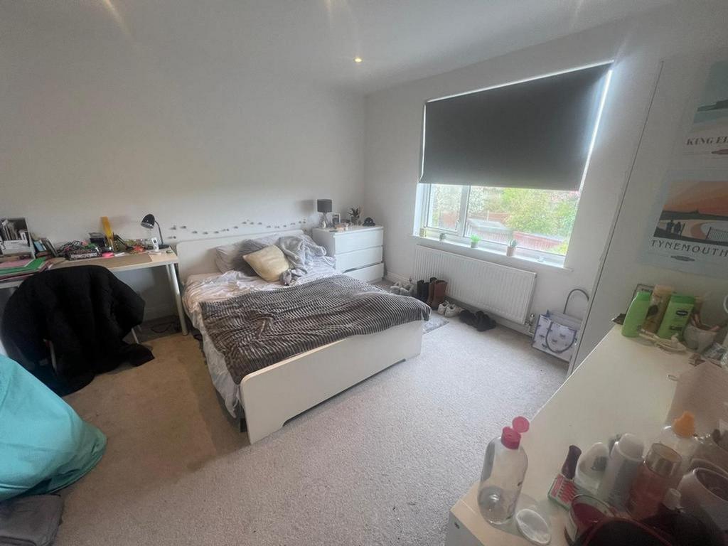 A bright and spacious double bedroom with ample...