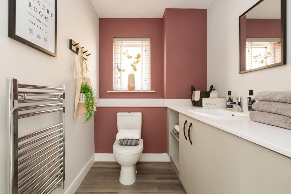 A downstairs WC and utility room adds convenience