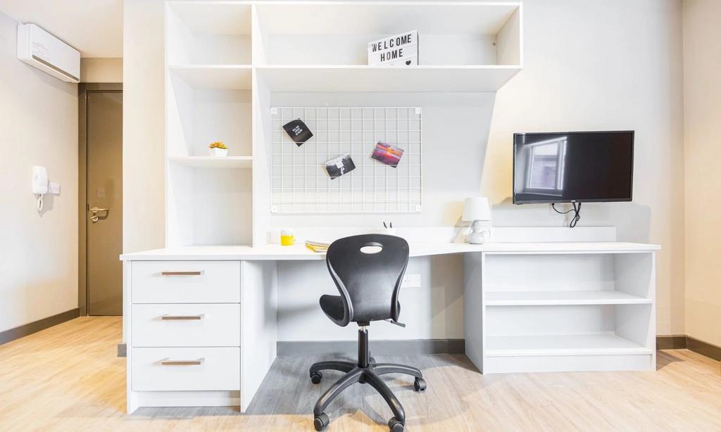 A modern and tidy study area featuring a spacio...