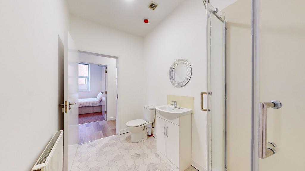 A bright and modern bathroom featuring a spacio...