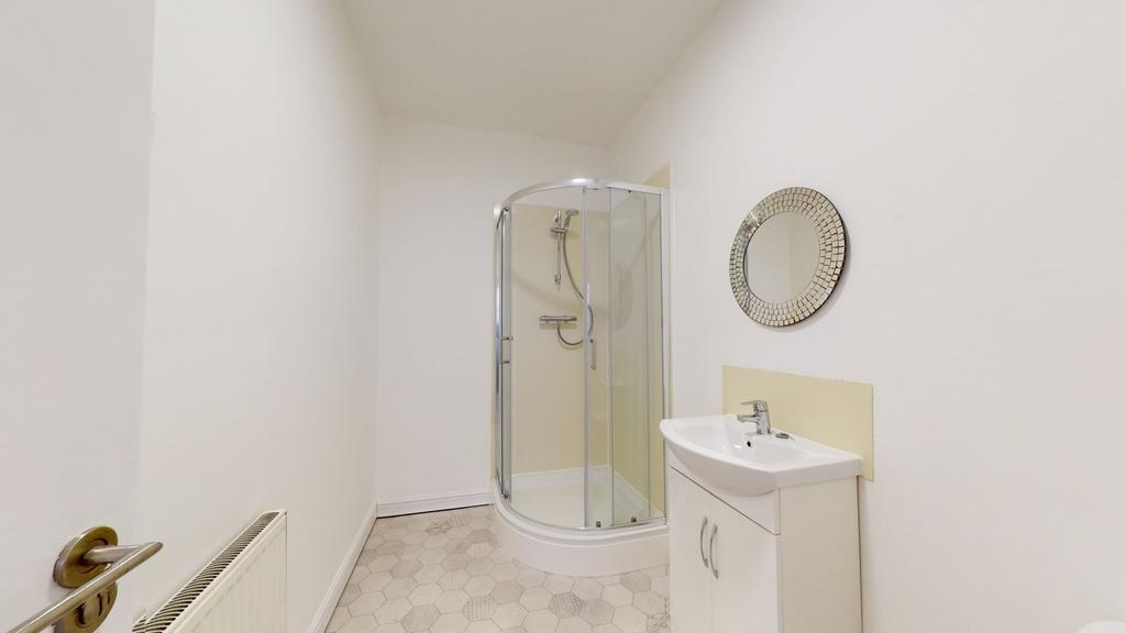 A bright and modern bathroom featuring a sleek ...