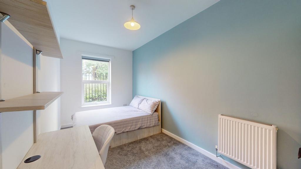 A bright and tidy double bedroom with ample nat...