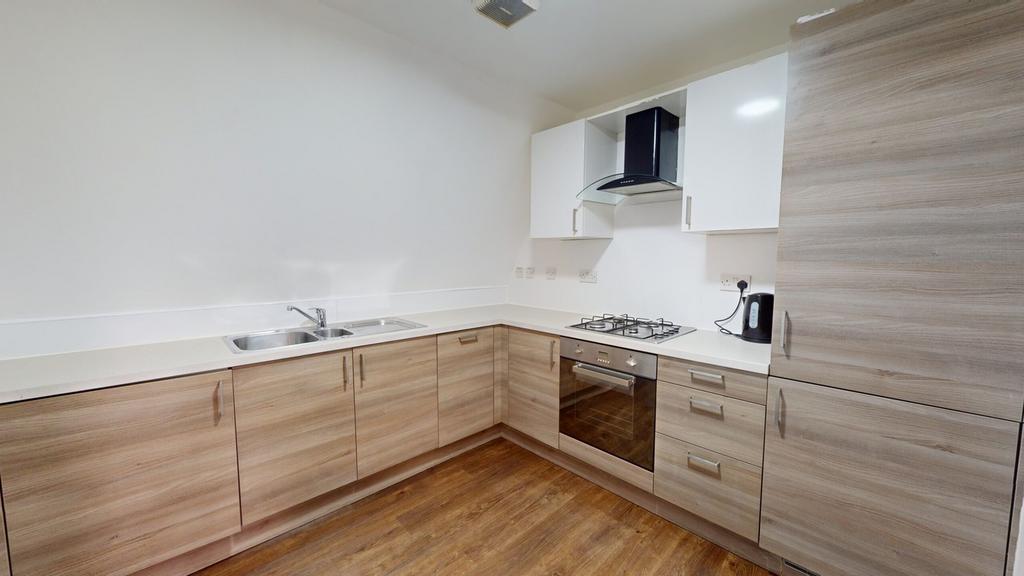 A modern and tidy kitchenette featuring ample s...