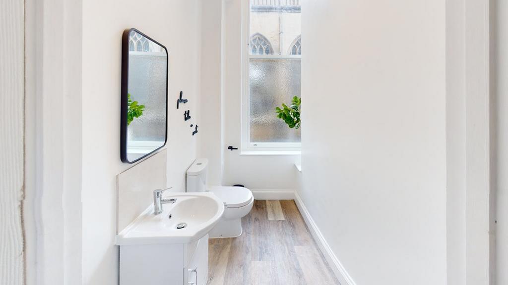 A bright and clean bathroom featuring modern fi...