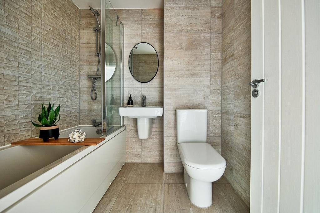 A main bathroom with high quality fixtures and...