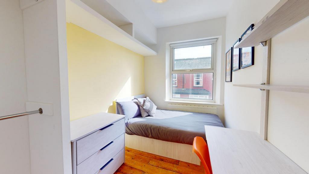 A bright and inviting double bedroom with ample...