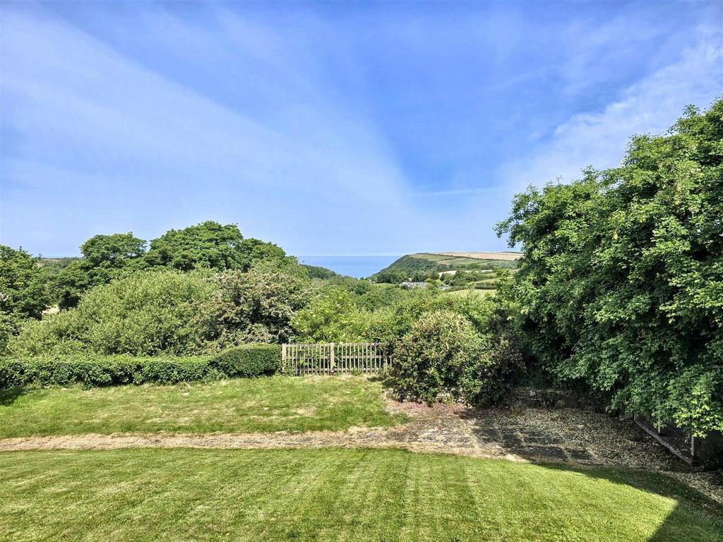 Garden and sea views from decking