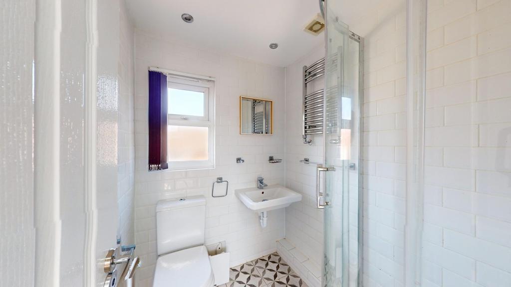 A bright and modern bathroom featuring a stylis...