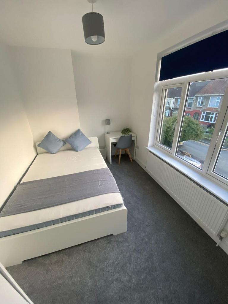 A bright and inviting double bedroom, perfect f...