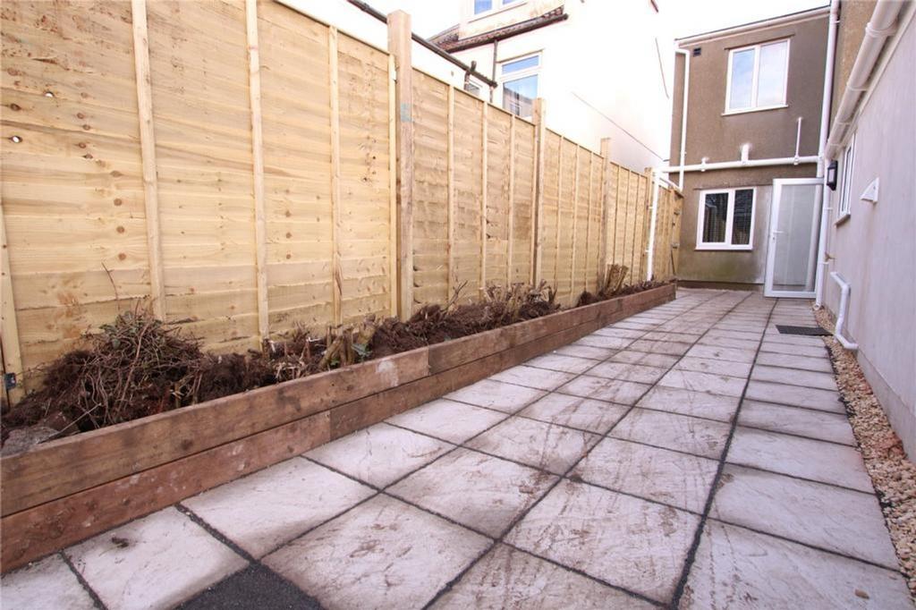 A spacious and tidy garden area that provides a...