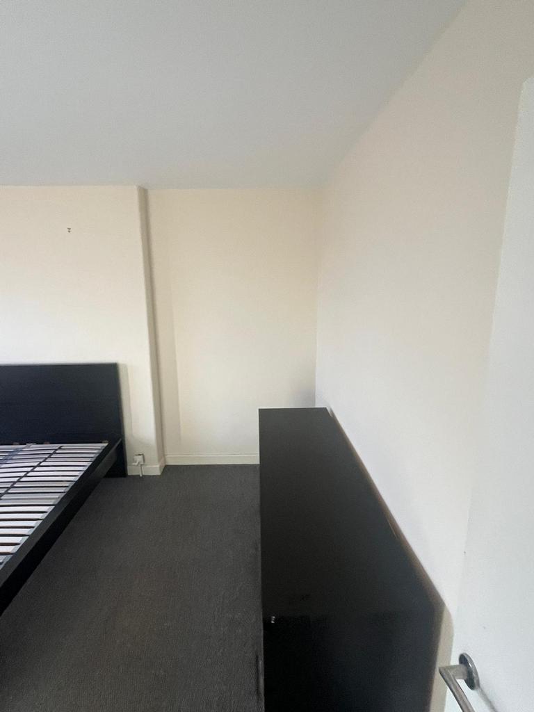 A spacious and tidy double bedroom with potenti...