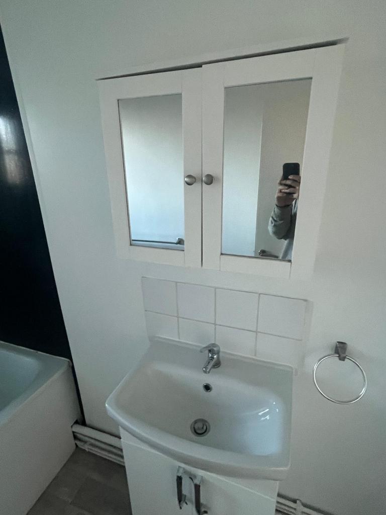 A modern and functional bathroom with clean lin...