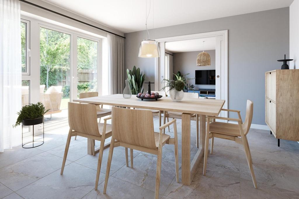 A bright and airy dining room with French doors...