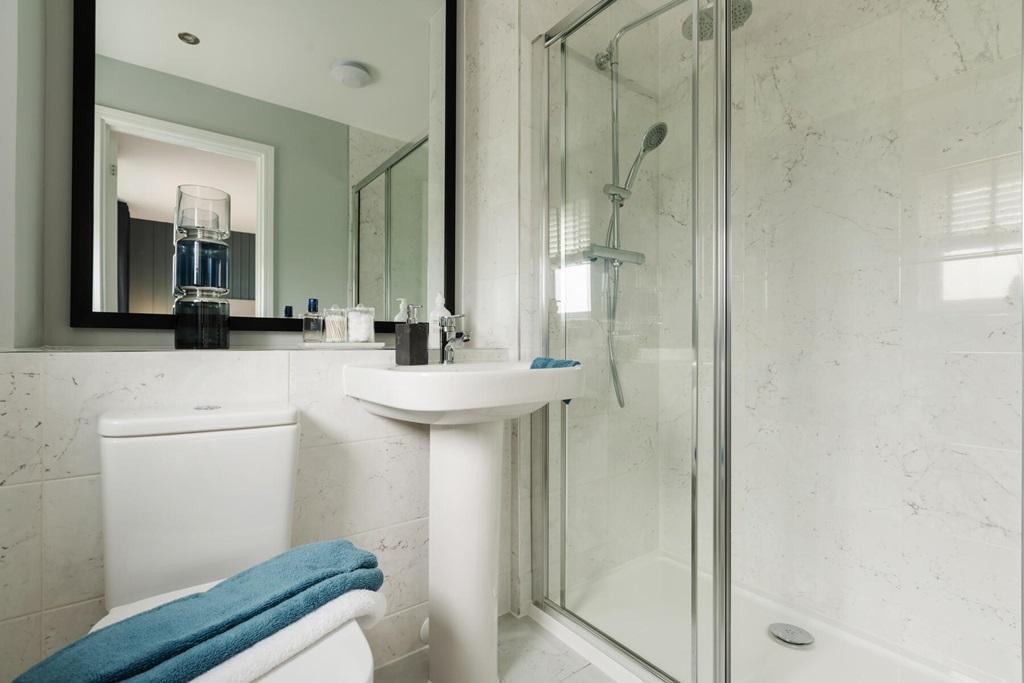 The ensuite bathroom features a double shower