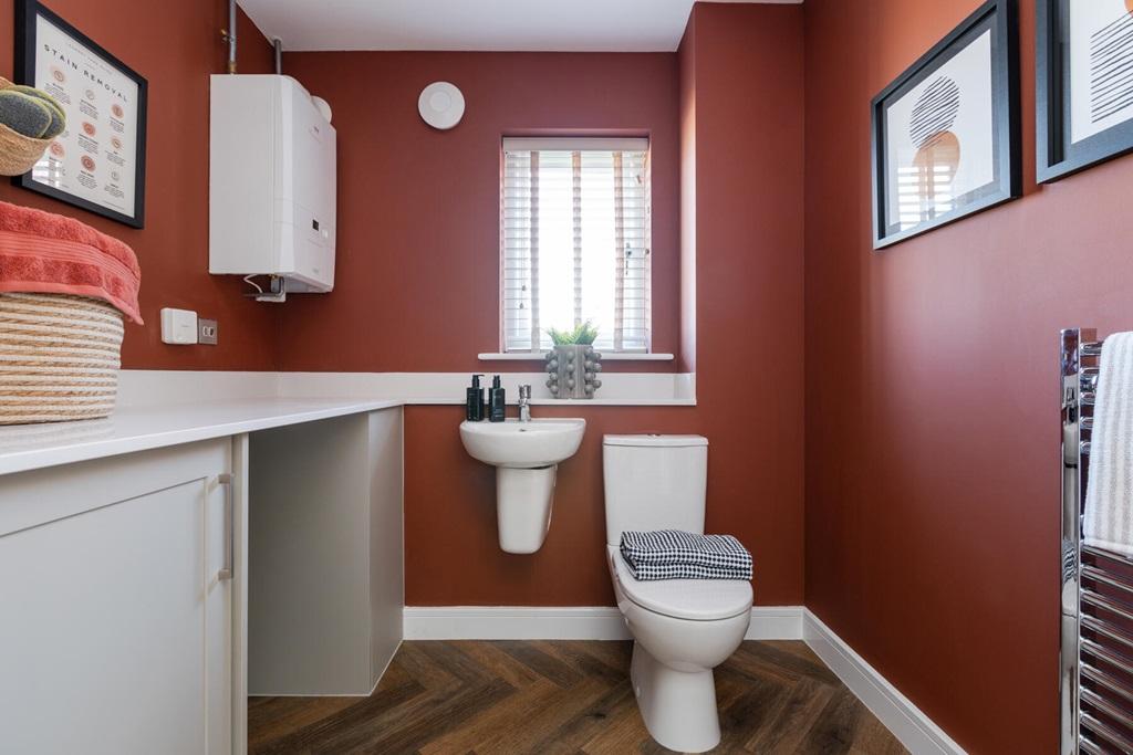A downstairs cloakroom and utility adds...