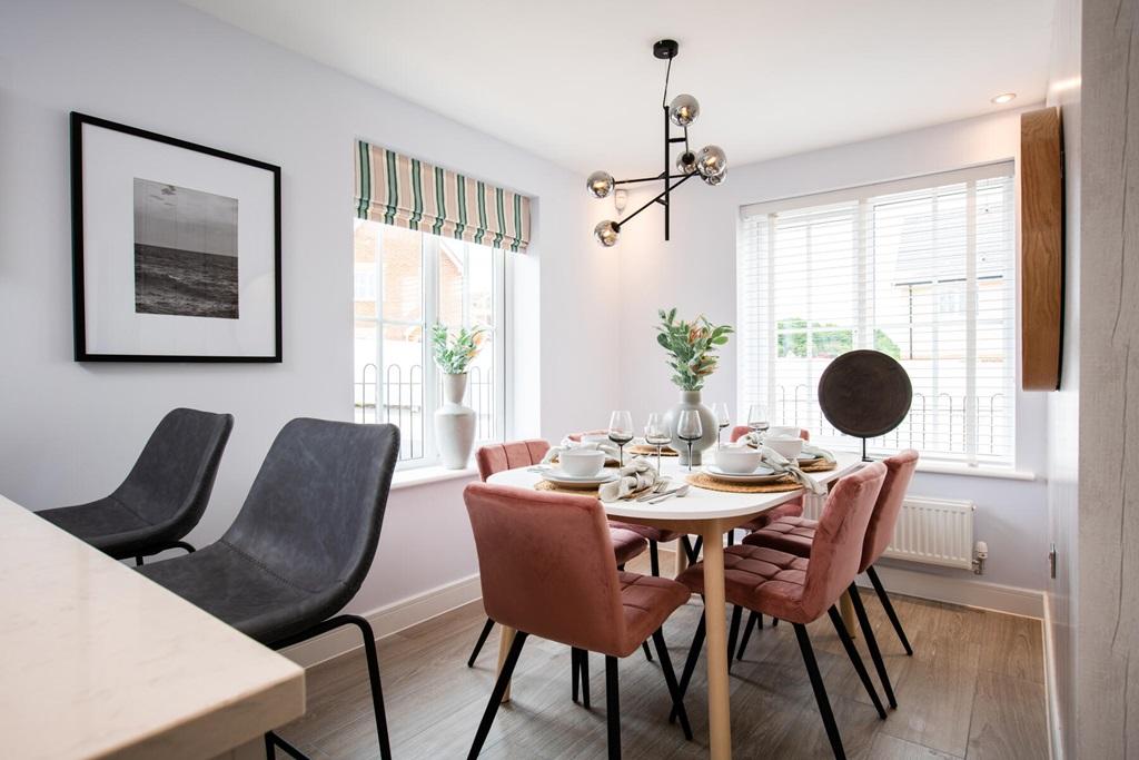 The dining area is flooded with natural light