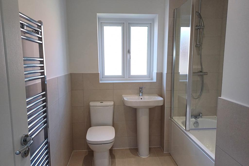 The contemporary bathroom with upgraded tiling...