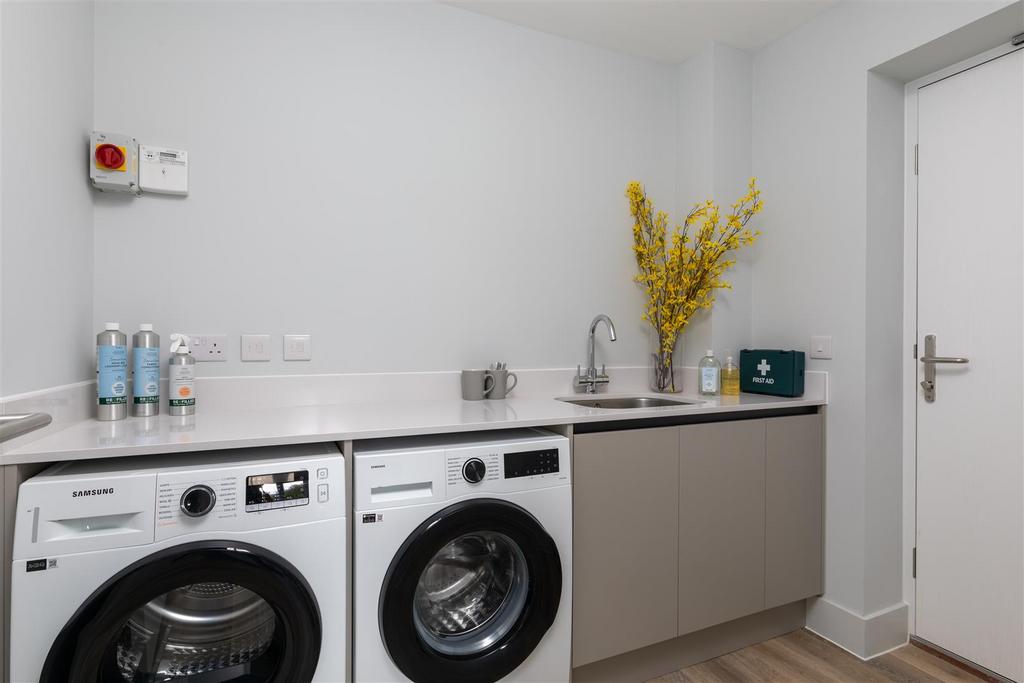 Utility space with room for washing machine and tu