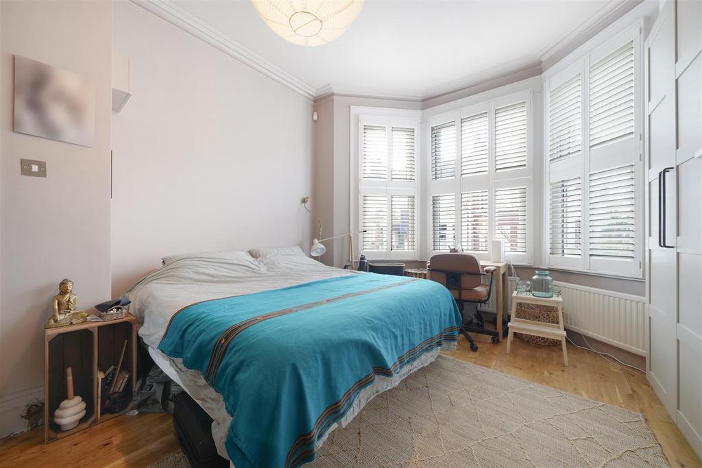 High ceilings in main bedroom into bay window