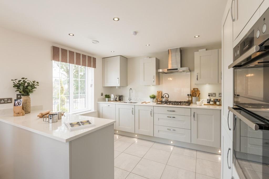 Beautifully designed kitchen with breakfast bar