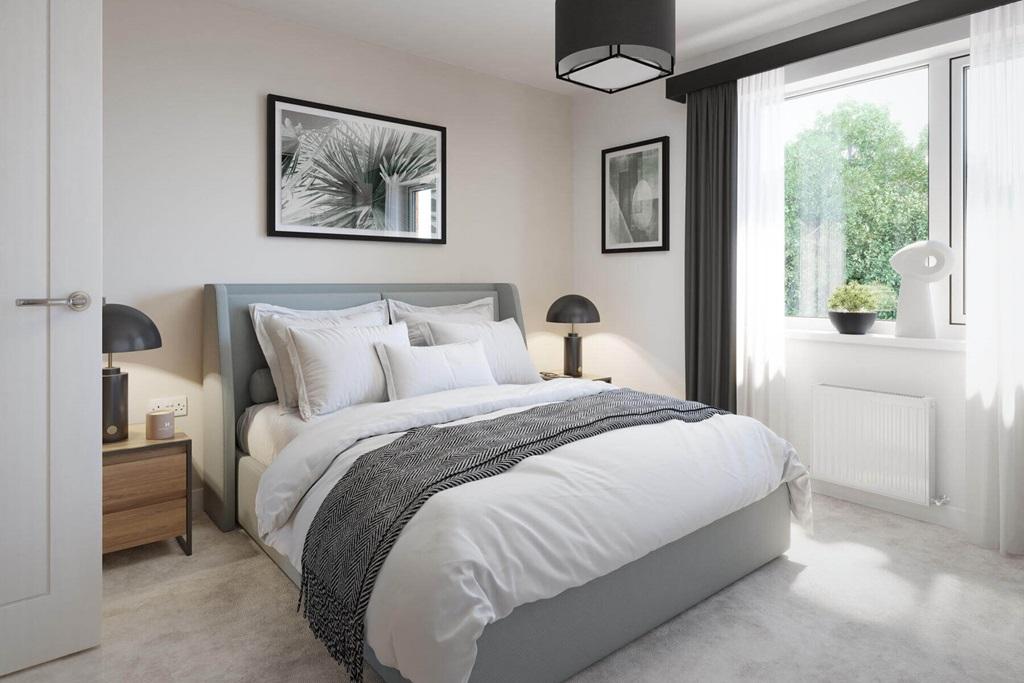 A spacious main bedroom offers a place to...