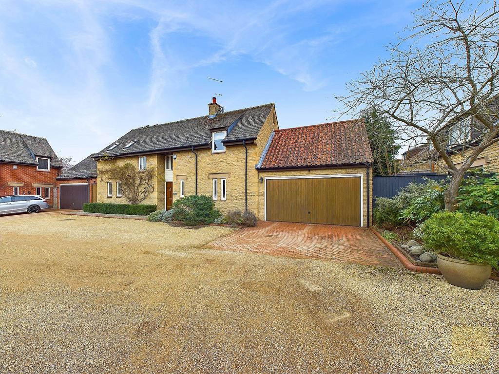 Front of the property showing garage and driveway