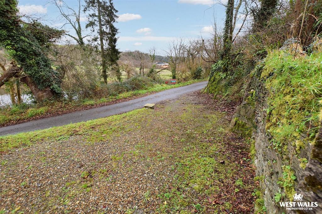 Entrance + Parking from Road
