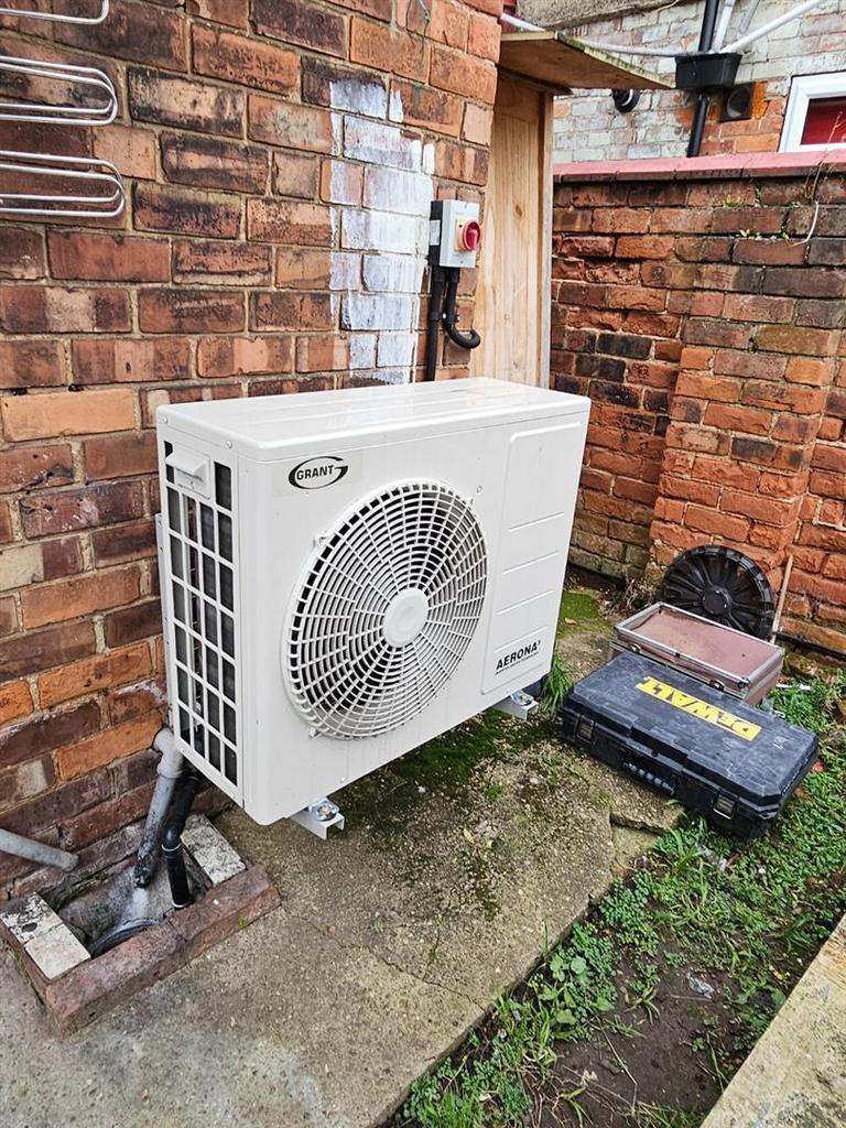 An air source heat pump (ASHP)