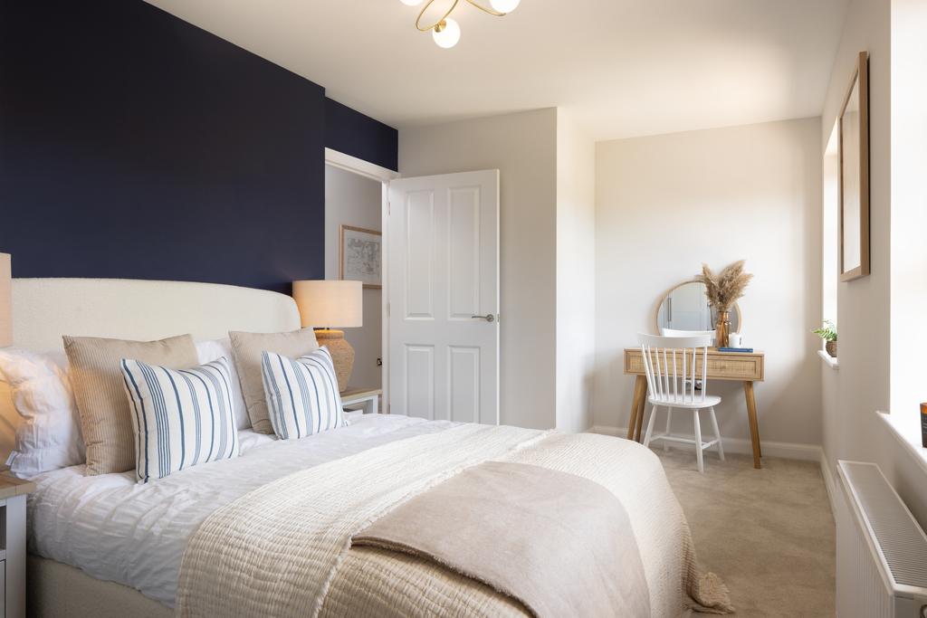 Internal shot of double bedroom in conwy show home