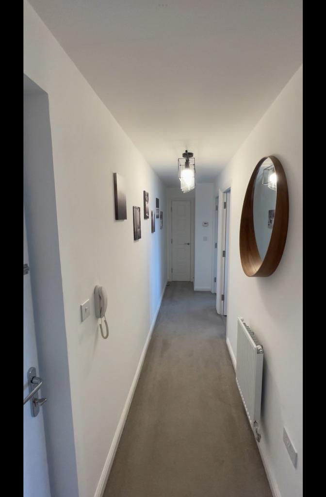 A clean and well-maintained hallway with stylis...
