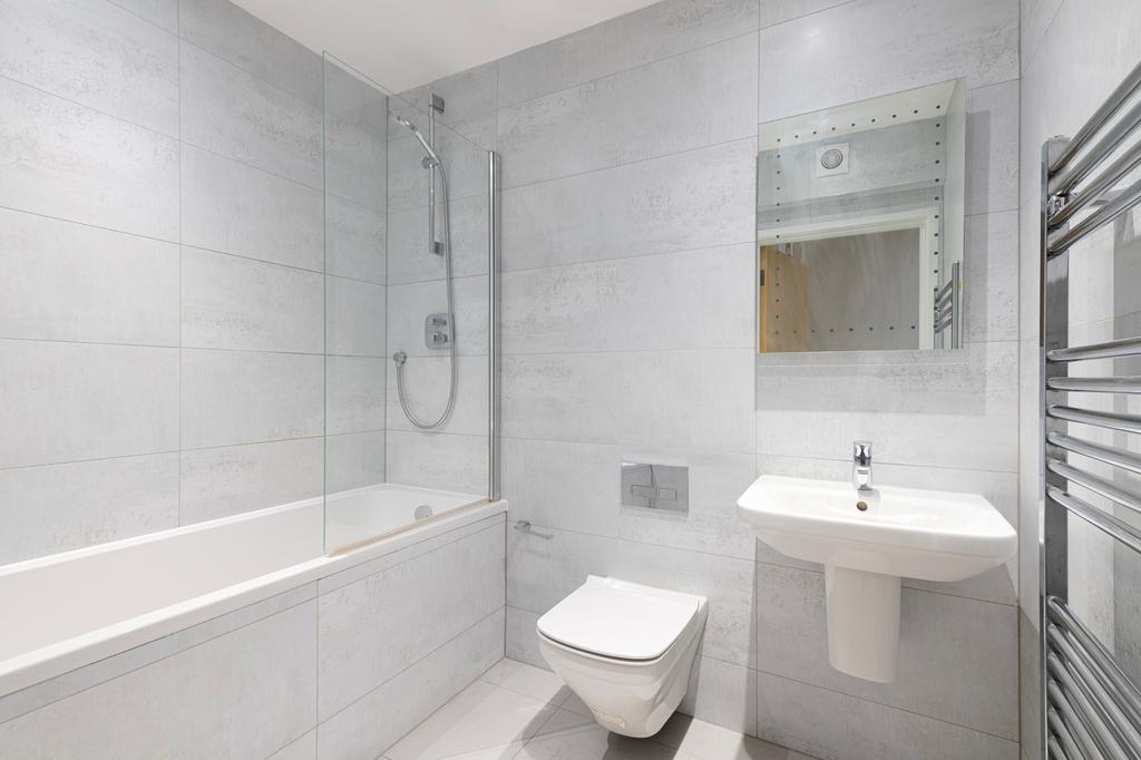 A modern and clean bathroom featuring both a ba...