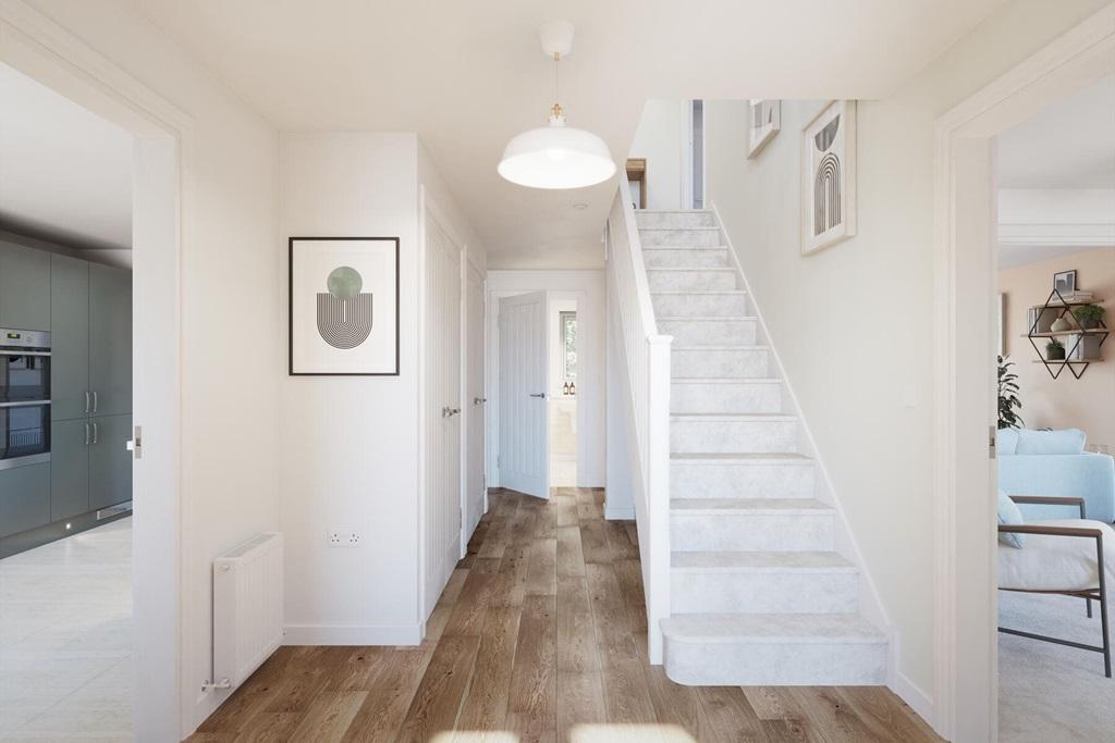 Large and welcoming hallway with storage cupboards