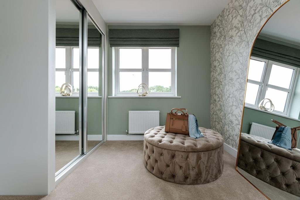 Main bedroom boasts a dedicated dressing area