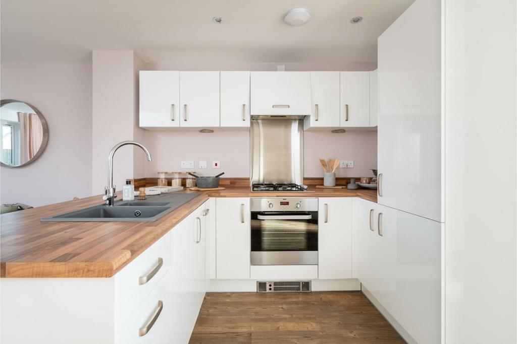 Fitted kitchen with ample storage and worktops