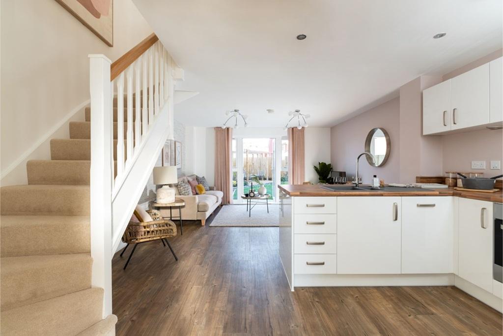 The light open plan kitchen/living space is...