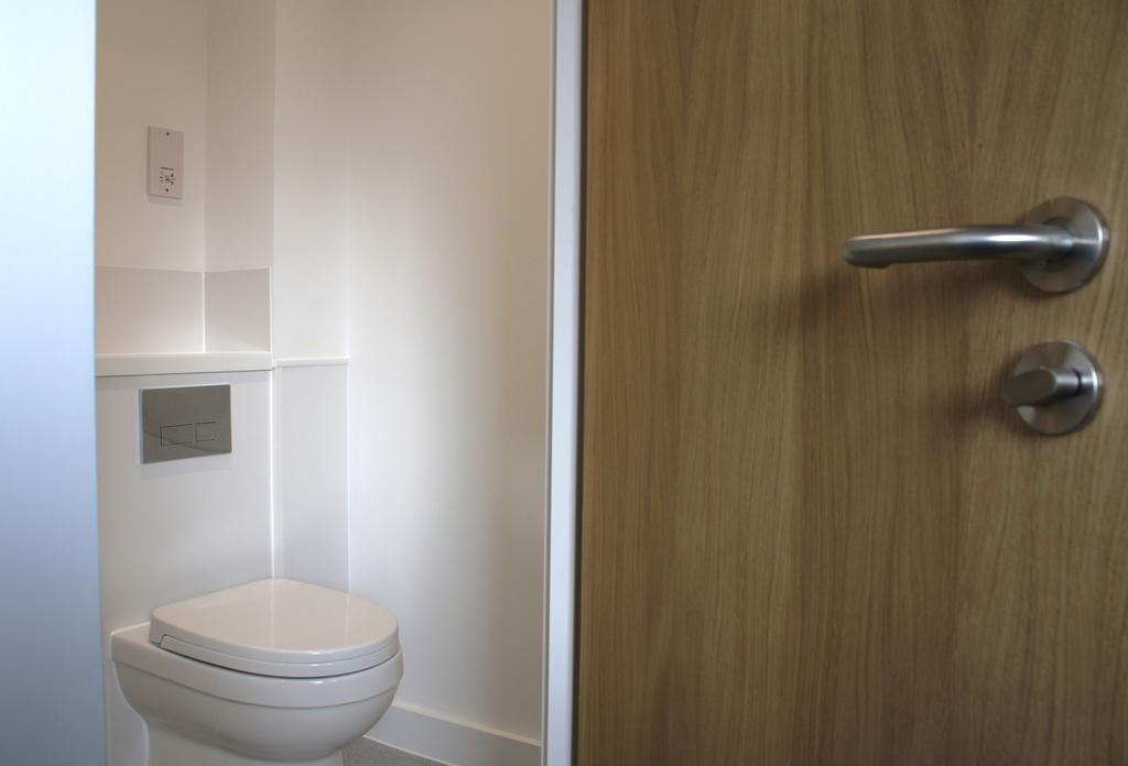 A modern and tidy single toilet with clean line...