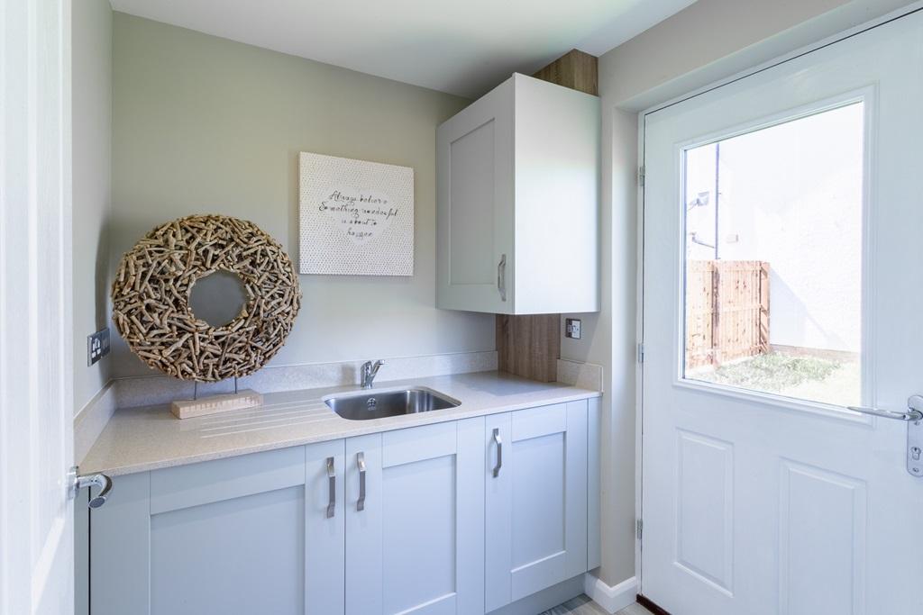 The utility room provides extra storage space