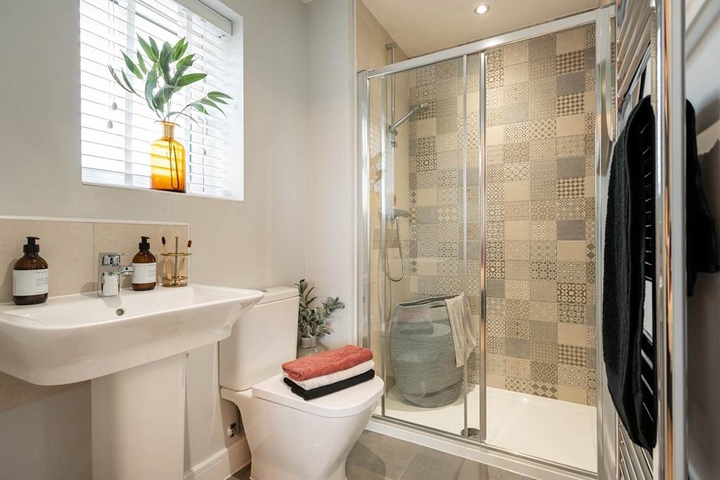 The en suite shower room offers added luxury