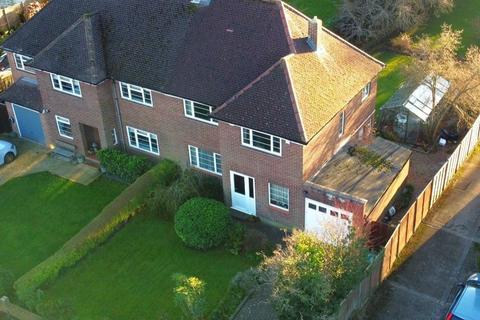 Blandford Road, with unusually large garden backing directly onto Bushy Park